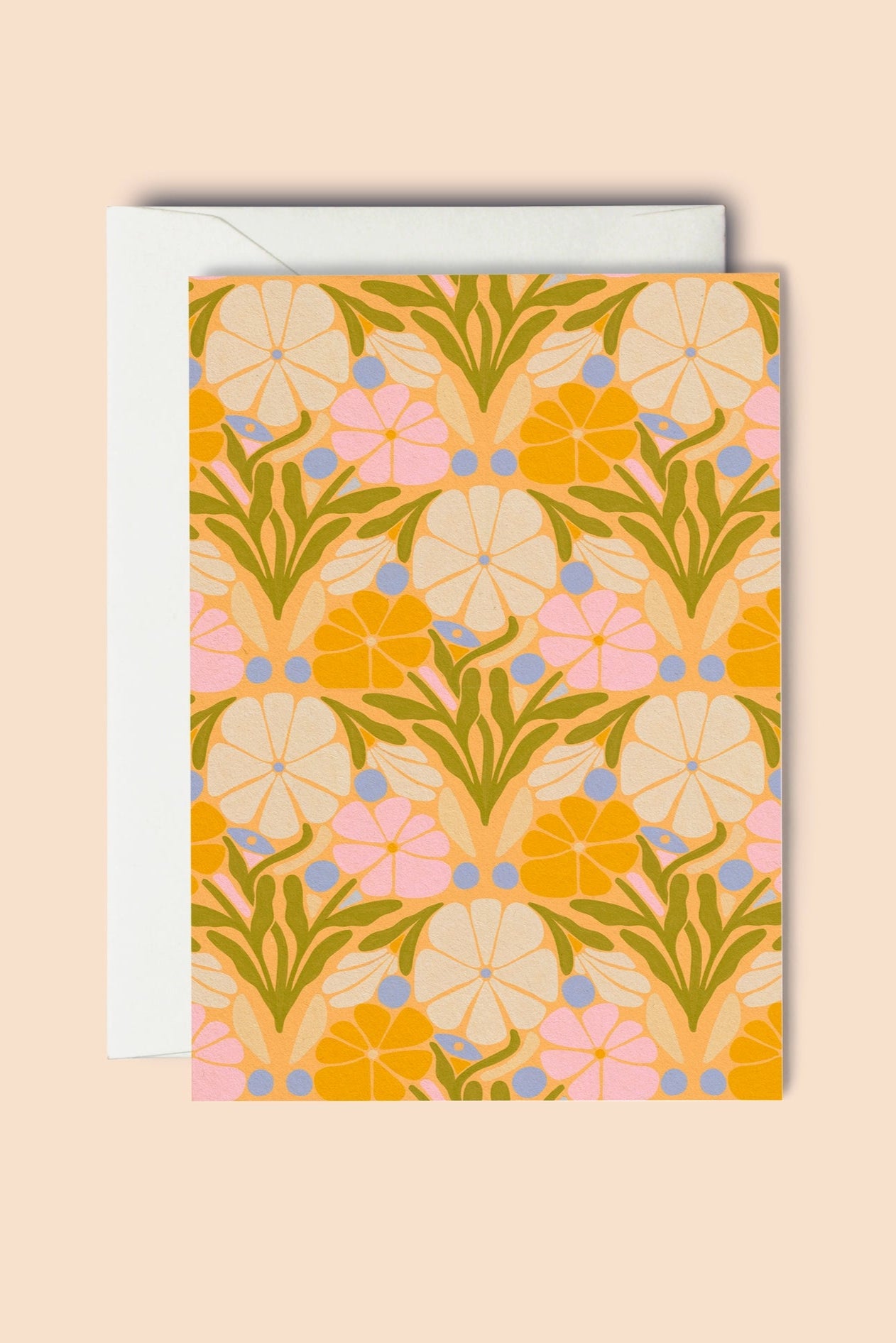 Floral patterned card with a white envelope on a beige background