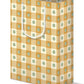 Gift bag with checkered pattern and green dots on a white background