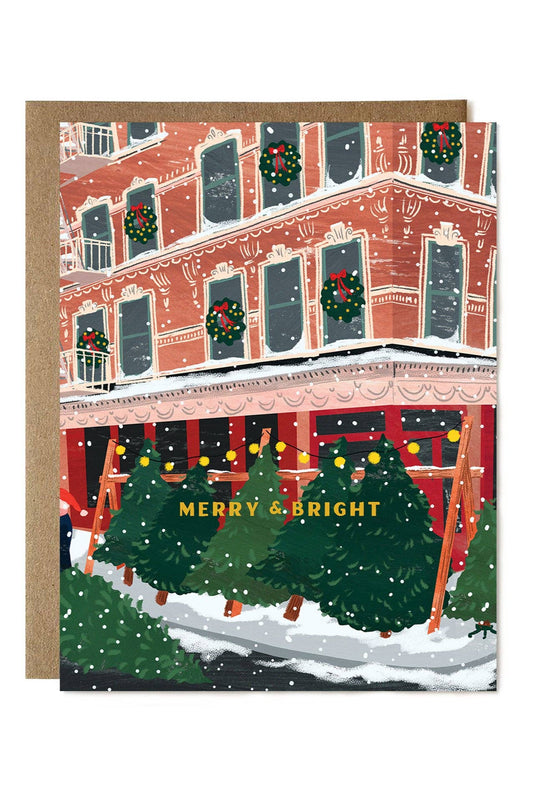 Christmas-themed notebook with a festive building illustration and 'Merry & Bright' text.