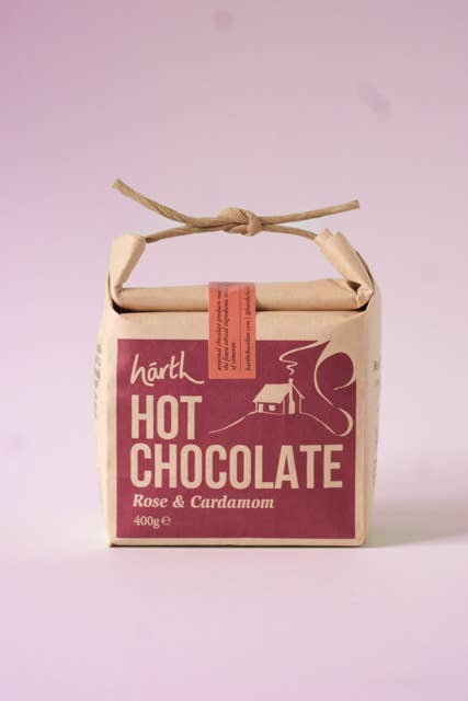 Box of Harth Hot Chocolate with rose and cardamom flavor on a light purple background